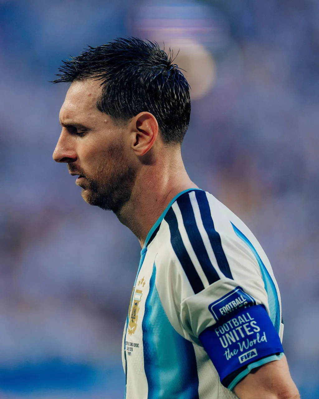 Lionel Messi in profile, wearing the Argentina captain’s armband