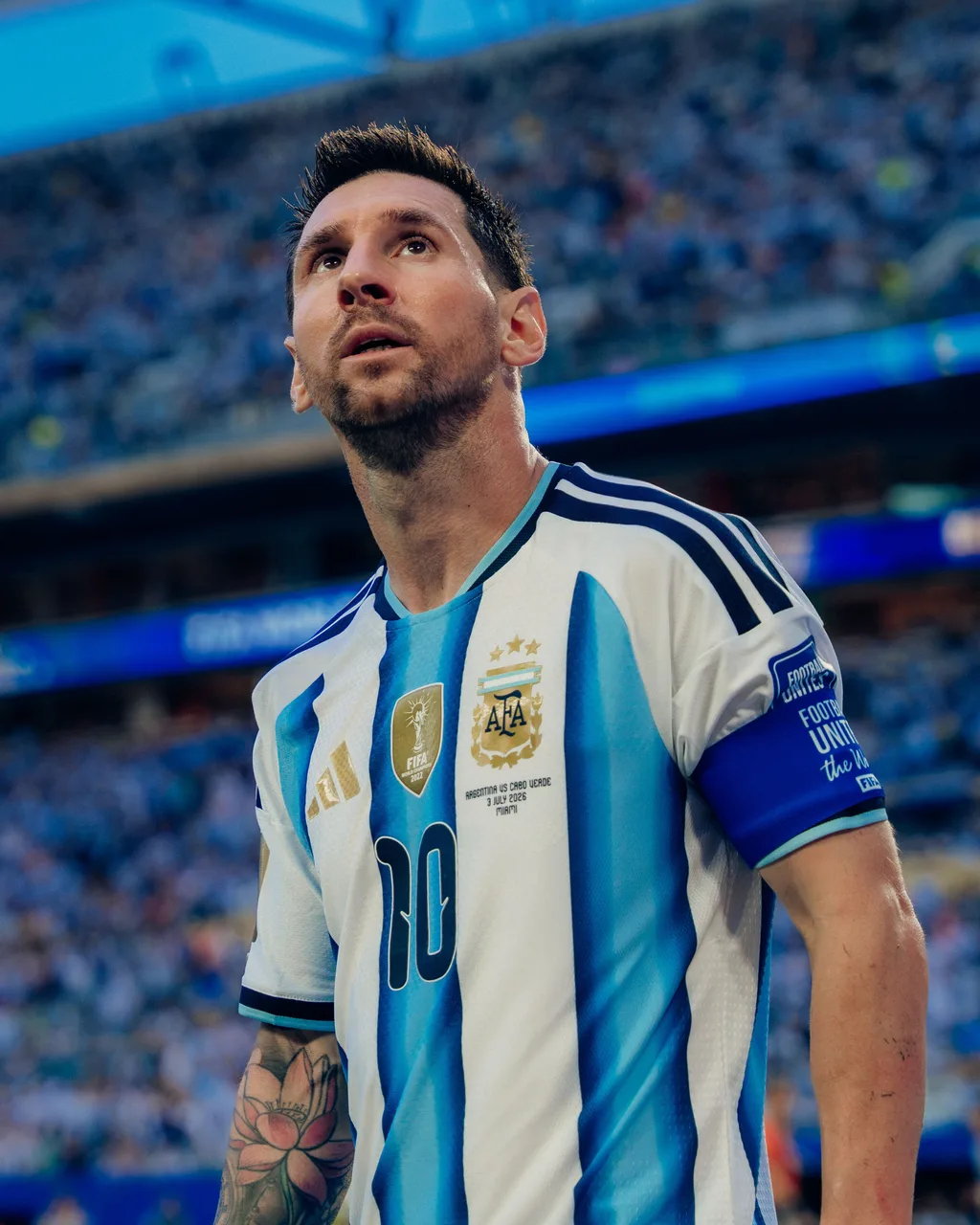 Lionel Messi looking up at the crowd