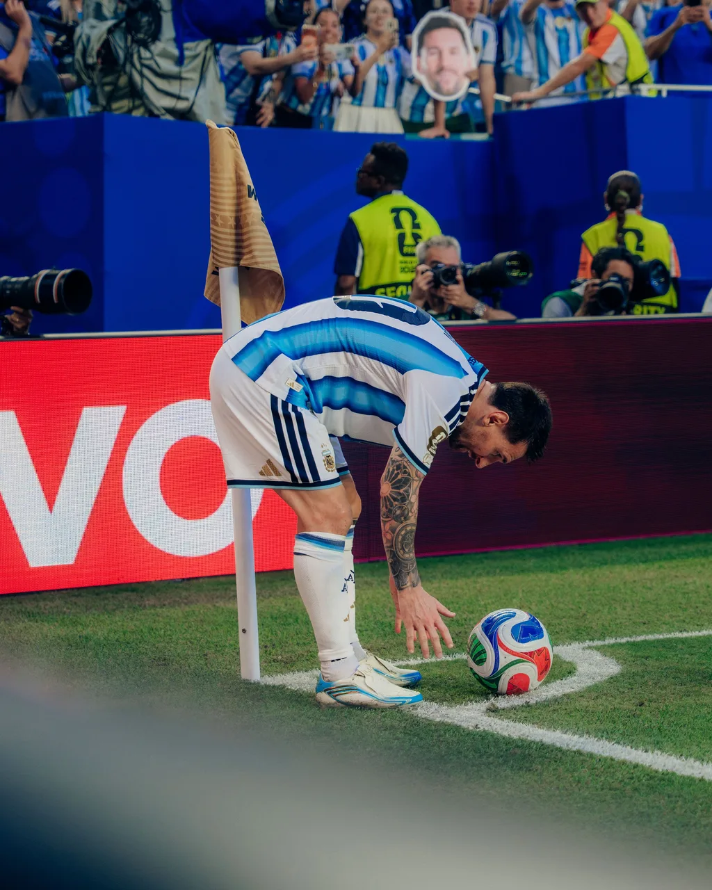 Lionel Messi placing the ball for a corner kick