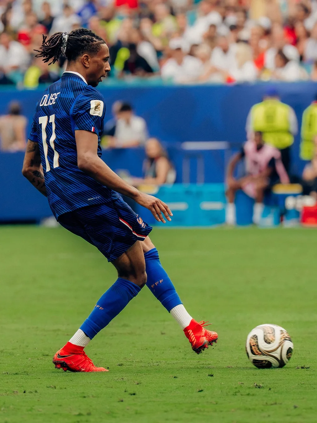 Michael Olise of France passing the ball